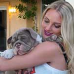Kirby Bliss hugs her Shrinkabull English bulldog puppy