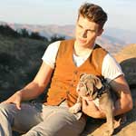 Nolan Gerard Funk, actor from Riddick, with Shrinkabull's puppy